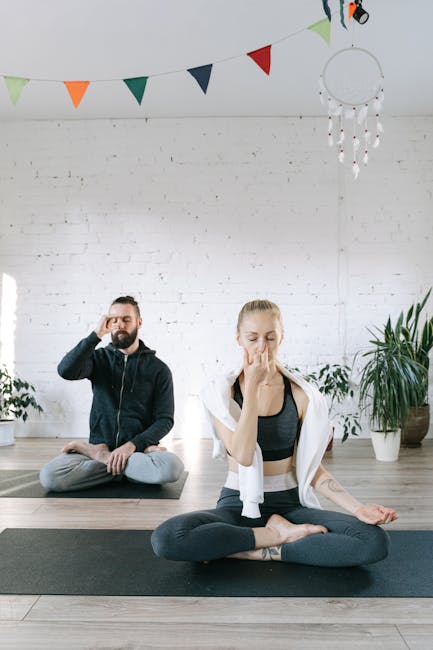 A serene woman with closed eyes practicing a breathing technique in a calm, light-filled room.